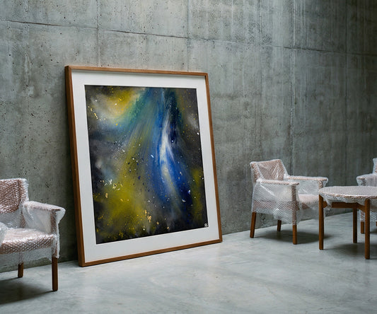 Abstract blue and yellow artwork in wooden frame styled against concrete wall in modern interior setting