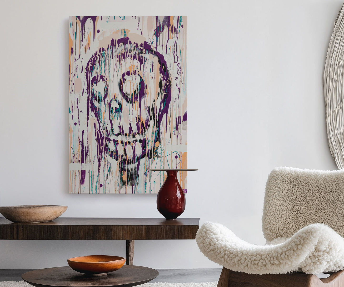 Large abstract skull wall art displayed above a wooden sideboard in a modern living room.