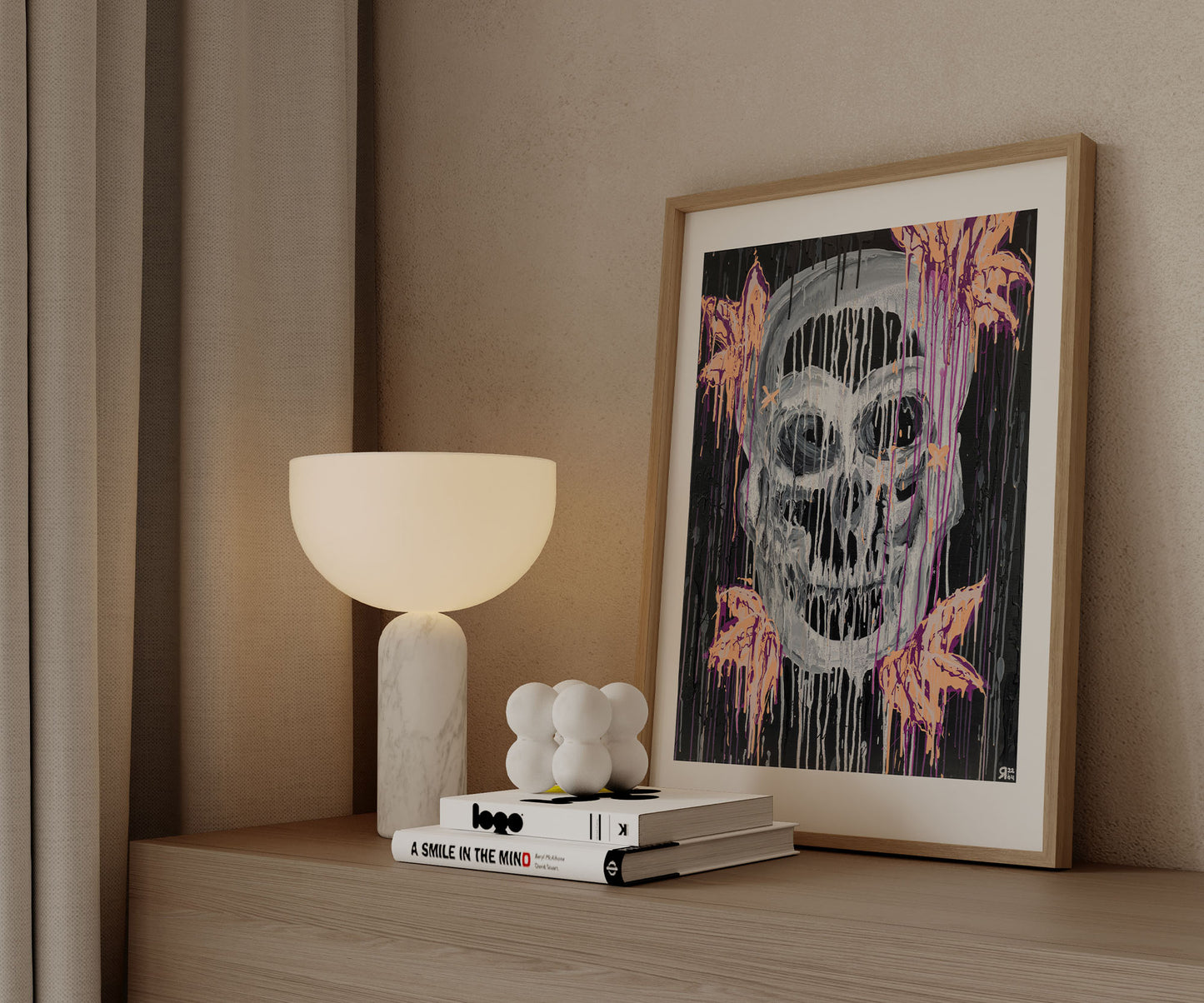 Framed skull abstract art print styled on a wooden cabinet with modern decor.