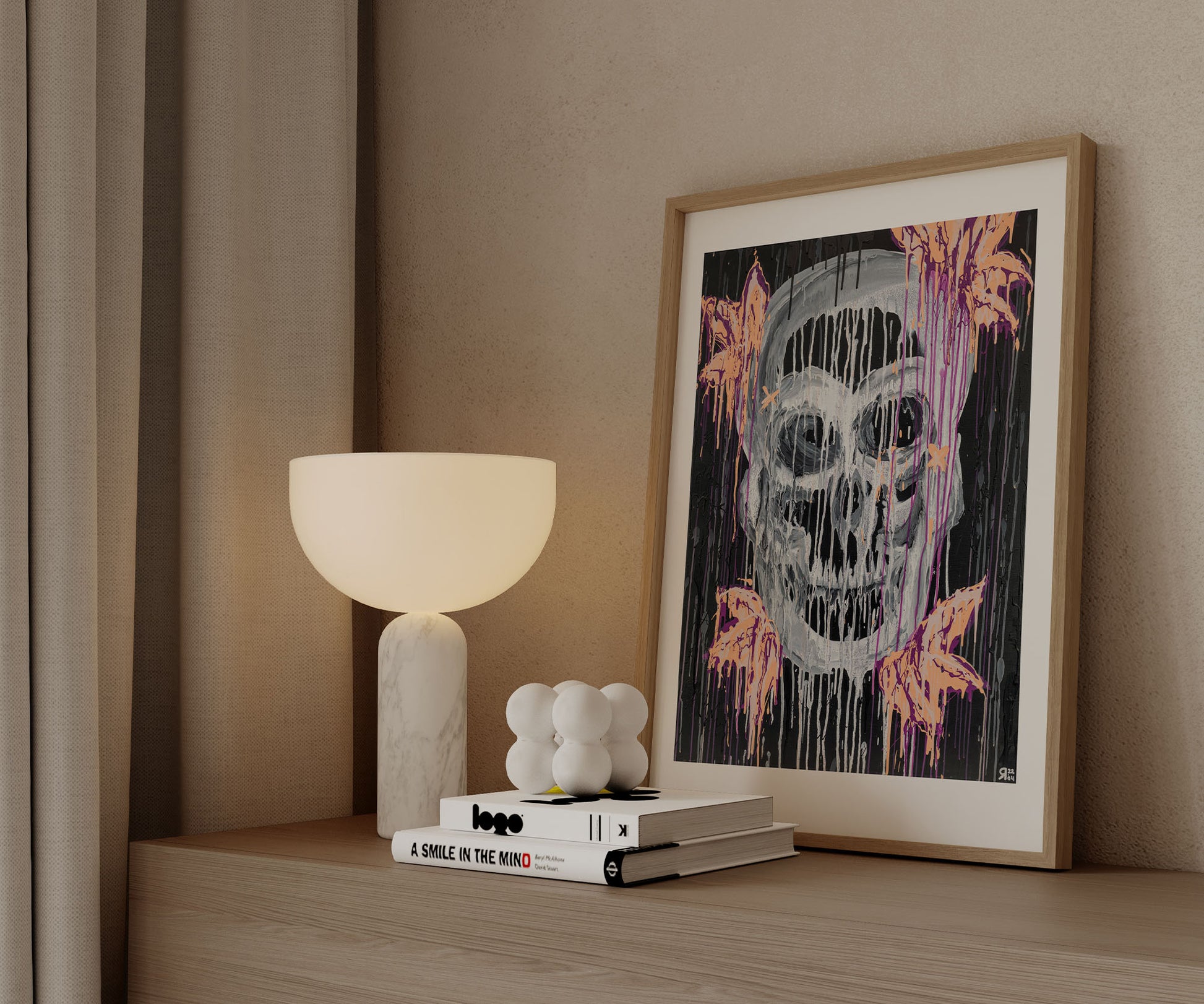 Framed skull abstract art print styled on a wooden cabinet with modern decor.