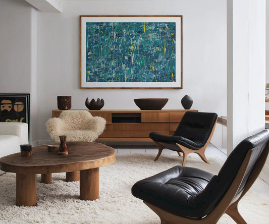 Large blue abstract wall art print displayed above a wooden sideboard in a modern living room.