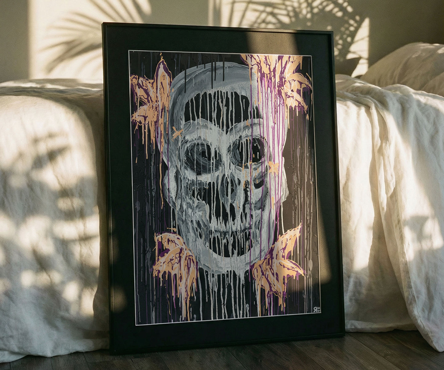 Framed skull abstract art print styled in a contemporary bedroom interior by The Jana Saga.