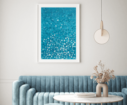 Blue abstract wall art above sofa in modern living room.