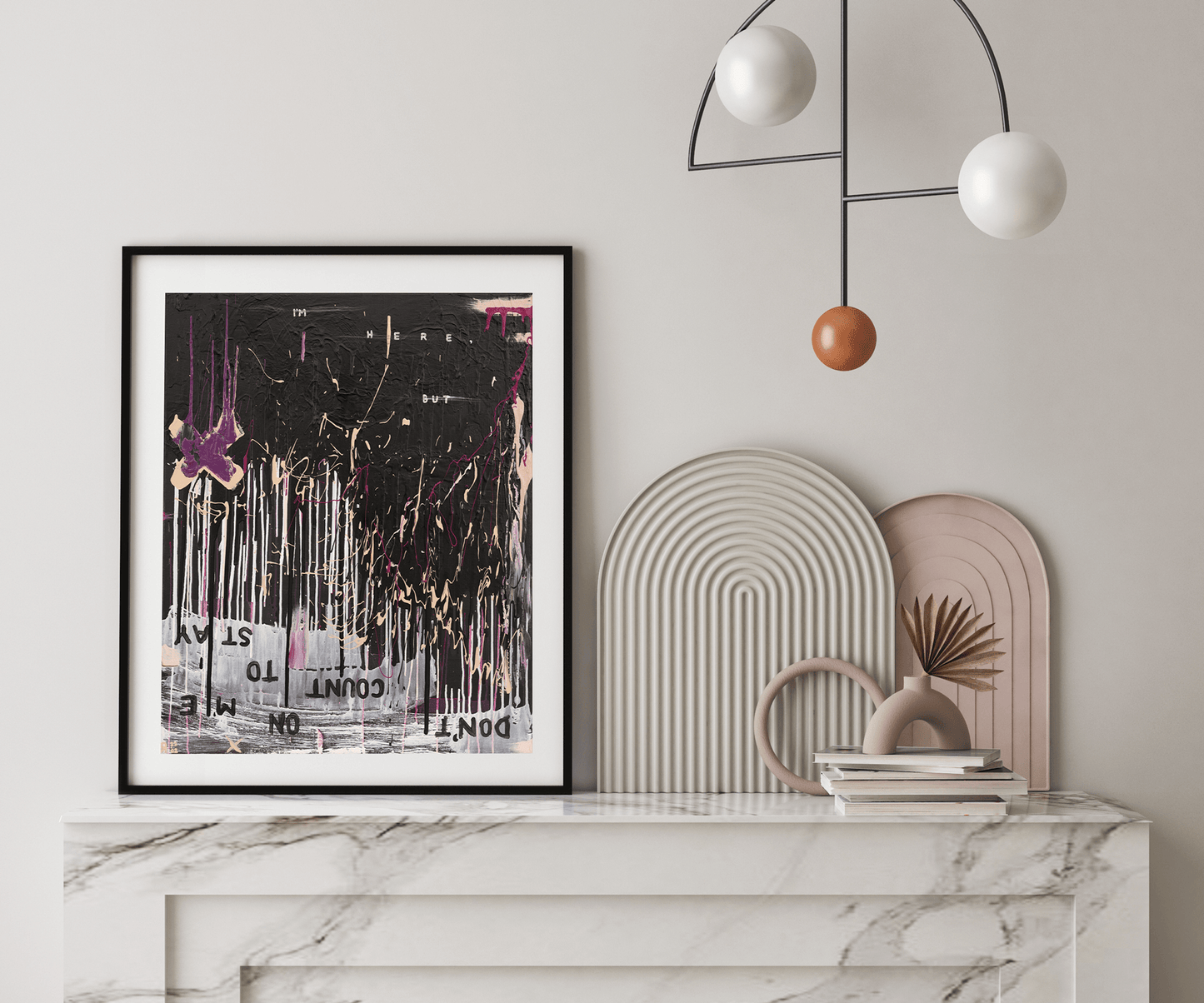 Framed abstract wall art print by The Jana Saga styled on a marble console in a modern interior.